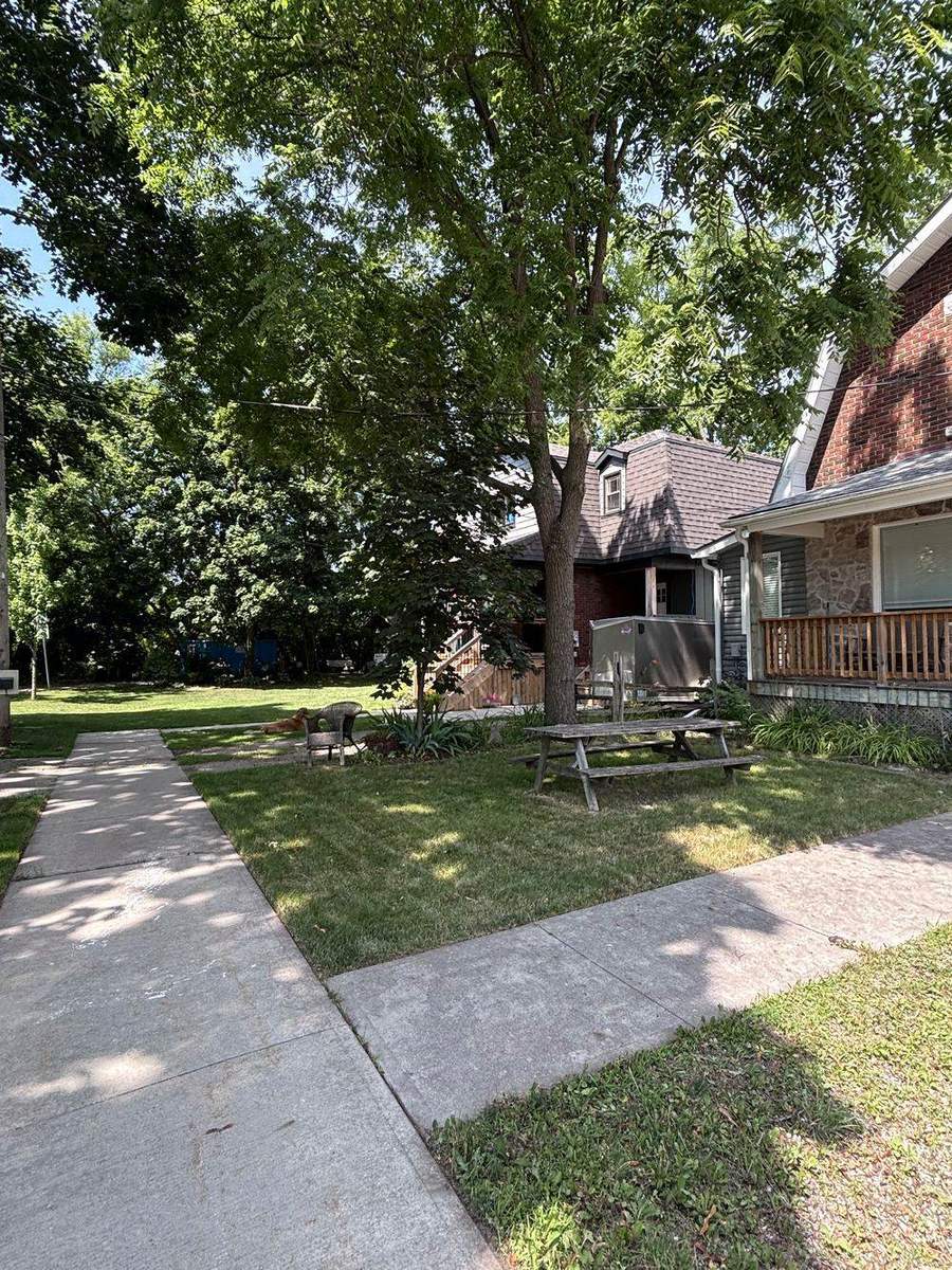 Striped front lawn maintained weekly by Yardex