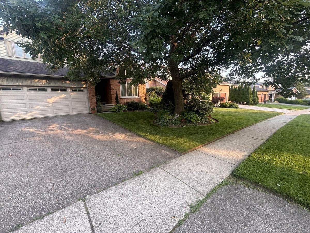 Well-kept front yard maintained while owners travel